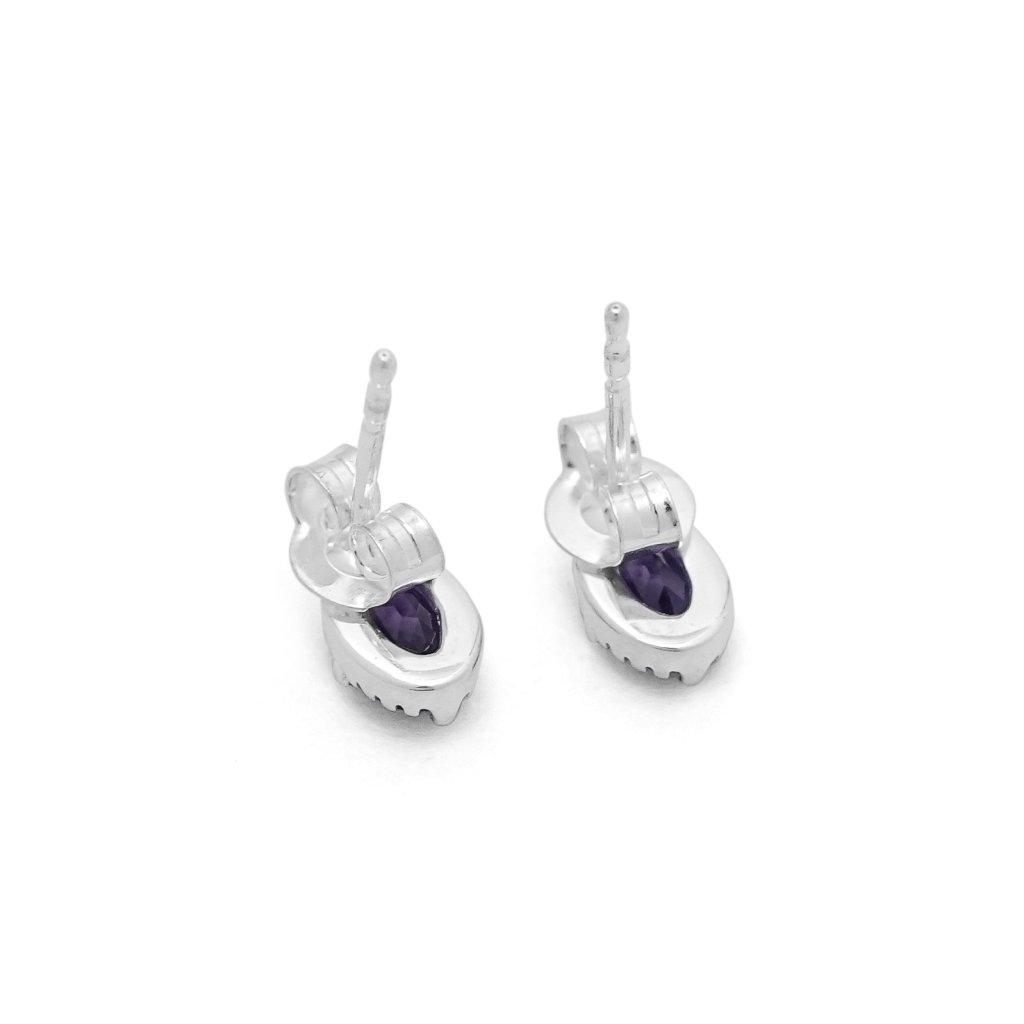 Amethyst 925 sterling silver stud earrings featuring oval-cut faceted purple gemstones in a detailed prong setting.